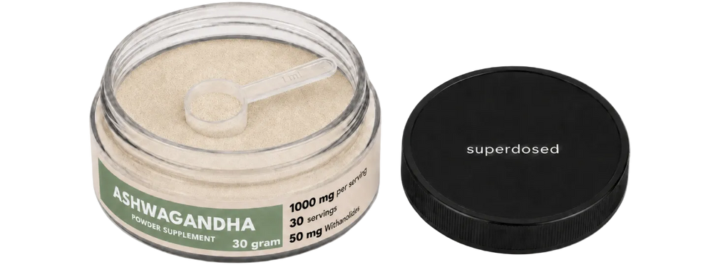 Jar of Ashwagandha powder supplement with black lid and green label on a white background