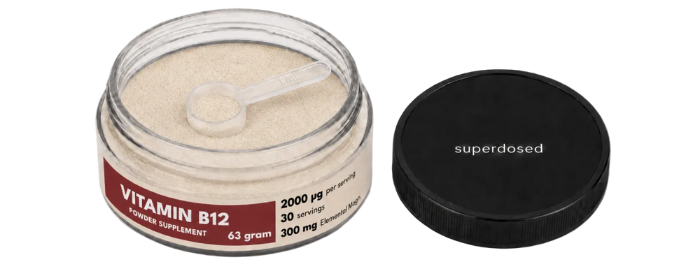 Vitamin B12 powder supplement jar with red and white label on a white background