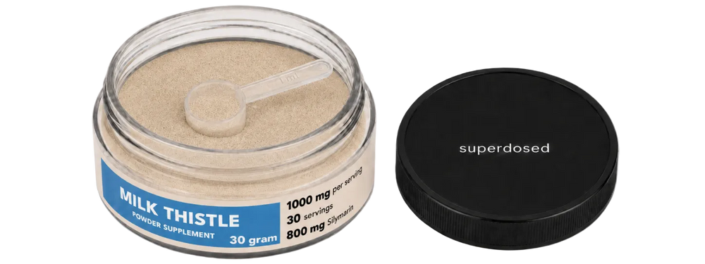 Jar of milk thistle powder supplement with label on a white background