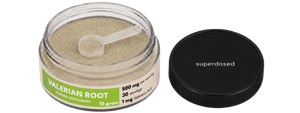 Jar of valerian root with a scoop and 'superdosed' branding on a white background