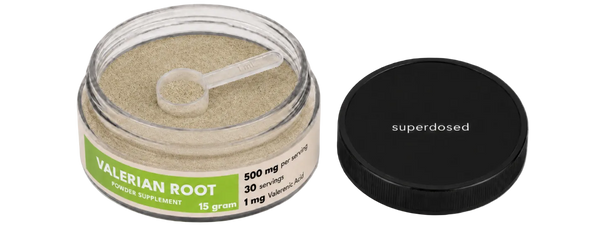 Jar of valerian root with a scoop and 'superdosed' branding on a white background
