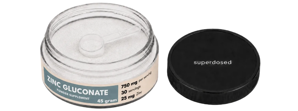 Jar of zinc gluconate powder supplement with label on a white background