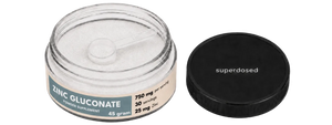 Jar of Zinc Gluconate supplement with 'superdosed' branding on a white background